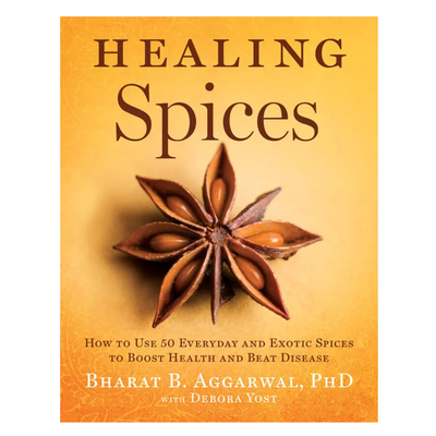 Book cover for 'Healing Spices' by Bharat B. Aggarwal, PhD with Deбора Yost, featuring a star anise illustration on a warm yellow-orange background.
