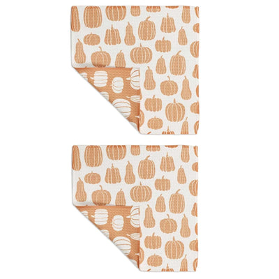 Two fabric swatches with pumpkin pattern on a white background
