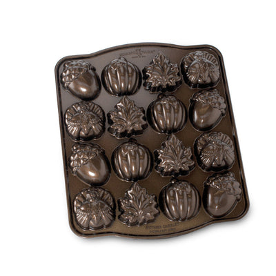 Baking mold with various shaped cavities on a white background