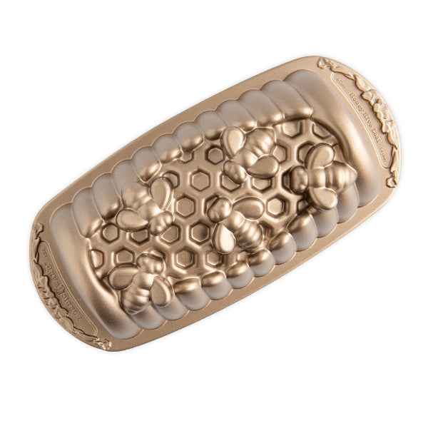 Gold and beige textured device on a white background