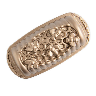 Gold and beige textured device on a white background